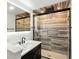 Modern bathroom showcasing a glass-enclosed shower with a rain showerhead and sleek fixtures at 8219 Bishops Ln, Indianapolis, IN 46217