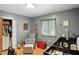 Well-decorated Bedroom features a crib, gray chair and natural light from the window at 8219 Bishops Ln, Indianapolis, IN 46217