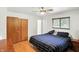 Comfortable bedroom with wood floors, ample closet space and plenty of natural light at 8219 Bishops Ln, Indianapolis, IN 46217