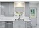 A bright and updated kitchen features stone countertops and stainless steel appliances at 8219 Bishops Ln, Indianapolis, IN 46217