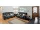 Comfortable living room with hardwood floors, natural light, and ample seating for entertaining at 8219 Bishops Ln, Indianapolis, IN 46217