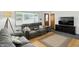 Cozy living room features hardwood floors, natural light, and comfortable seating, perfect for relaxation at 8219 Bishops Ln, Indianapolis, IN 46217