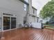 View of the wooden deck and backyard, featuring a table, chairs and hot tub at 8415 Alcona Dr, Indianapolis, IN 46237