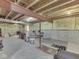 Unfinished basement with exposed beams, insulation, and concrete flooring at 8415 Alcona Dr, Indianapolis, IN 46237