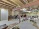 Unfinished basement with exposed support beams and concrete flooring at 8415 Alcona Dr, Indianapolis, IN 46237