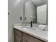 Bathroom with granite vanity top, framed mirror, and neutral paint at 8415 Alcona Dr, Indianapolis, IN 46237