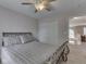 Bedroom with a metal bed frame, closet, and hallway entrance at 8415 Alcona Dr, Indianapolis, IN 46237