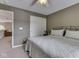 Cozy bedroom with ceiling fan and doorway to the living room at 8415 Alcona Dr, Indianapolis, IN 46237