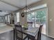 Dining room with backyard views through sliding glass door, connecting to the living room at 8415 Alcona Dr, Indianapolis, IN 46237