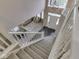 Bright foyer view from staircase looking into the formal living and dining room at 8415 Alcona Dr, Indianapolis, IN 46237