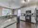 Bright kitchen with stone countertops, stainless steel appliances and natural light at 8415 Alcona Dr, Indianapolis, IN 46237