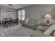 Cozy living space featuring a comfortable sofa, dining table, and natural light, creating a relaxing atmosphere at 8415 Alcona Dr, Indianapolis, IN 46237