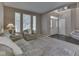 Comfortable living room with natural light, neutral decor, and a view of the staircase and front door at 8415 Alcona Dr, Indianapolis, IN 46237