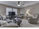Spacious living room with natural light, ceiling fan, and comfortable seating at 8415 Alcona Dr, Indianapolis, IN 46237