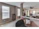 Open-concept living space featuring natural light and views of the fireplace and dining area at 8415 Alcona Dr, Indianapolis, IN 46237