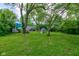 Spacious backyard offers lots of open space and shade for entertaining and relaxing at 8540 E 37Th Pl, Indianapolis, IN 46226