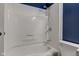 Bright white tub and shower combo featured in this clean bathroom at 8540 E 37Th Pl, Indianapolis, IN 46226