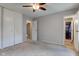 Neutral bedroom features a ceiling fan, closet and carpeted floors at 8540 E 37Th Pl, Indianapolis, IN 46226