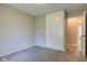 Neutral bedroom offers carpeting, closet and door to the rest of the house at 8540 E 37Th Pl, Indianapolis, IN 46226