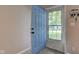 Open blue front door leading into the house with a view of the outdoors at 8540 E 37Th Pl, Indianapolis, IN 46226