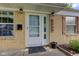 Close up of home's front entrance, with glass door, address numbers and decorative shutters at 8540 E 37Th Pl, Indianapolis, IN 46226