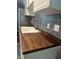 Beautiful kitchen with white cabinets, wooden countertop, stainless steel appliances and modern backsplash at 8540 E 37Th Pl, Indianapolis, IN 46226