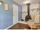 Cozy living room with a vintage wood-burning stove and white stone fireplace at 8540 E 37Th Pl, Indianapolis, IN 46226