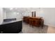 Finished basement area with a bar and seating, carpet, and tile at 8578 Nolan Dr, Fishers, IN 46038