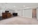Finished basement featuring a wet bar area, seating area, and built-in shelving providing stylish storage solutions at 8578 Nolan Dr, Fishers, IN 46038