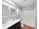 Bathroom features a double vanity with contemporary faucets, vanity mirrors, and a tub-shower combo for functionality at 8578 Nolan Dr, Fishers, IN 46038