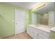 Bright bathroom boasts ample vanity space and a shower-tub combo, complete with light green walls at 8578 Nolan Dr, Fishers, IN 46038