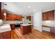 Spacious kitchen with stainless steel appliances, center island, and built-in desk area, ideal for modern living at 8578 Nolan Dr, Fishers, IN 46038