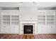 Cozy living room featuring a fireplace flanked by built-in bookcases, perfect for relaxation and entertainment at 8578 Nolan Dr, Fishers, IN 46038