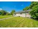 Home has green lawn, mature trees, sidewalk and good curb appeal at 901 N Greenbriar Rd, Muncie, IN 47304