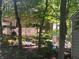 Lush backyard with a deck and grill, offering a perfect setting for outdoor entertaining and relaxation at 908 Queensbury Dr, Noblesville, IN 46062