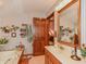 Charming bathroom featuring a sink and a door leading into an adjacent bedroom at 908 Queensbury Dr, Noblesville, IN 46062