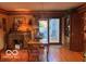 Traditional dining area features hardwood floors, vintage light fixture, desk and access to the outdoor space at 908 Queensbury Dr, Noblesville, IN 46062