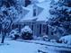 Charming two-story home covered in snow, showcasing a cozy winter ambiance and curb appeal at 908 Queensbury Dr, Noblesville, IN 46062