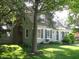 Charming home featuring dormer windows, a manicured lawn, and mature trees for added curb appeal at 908 Queensbury Dr, Noblesville, IN 46062