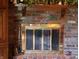 The living room features a brick fireplace and a dark wood mantel with decor at 908 Queensbury Dr, Noblesville, IN 46062
