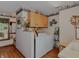 Functional laundry room with washer, dryer, and storage cabinets for organization at 908 Queensbury Dr, Noblesville, IN 46062