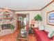The living room features a fireplace, hardwood floors, and a doorway to the dining area at 908 Queensbury Dr, Noblesville, IN 46062