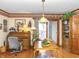 Cozy office features a secretary desk, wood floors, and sliding glass doors leading to the backyard at 908 Queensbury Dr, Noblesville, IN 46062