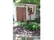 Charming shed in a landscaped backyard with a birdhouse, perfect for garden storage and outdoor projects at 908 Queensbury Dr, Noblesville, IN 46062