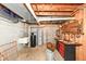 Functional utility room with sink, water heater, and ample storage space for tools and equipment at 908 Queensbury Dr, Noblesville, IN 46062