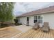 Backyard patio featuring a wooden deck, chairs, and access to the house, great for outdoor relaxation at 939 Arabian Way, Bargersville, IN 46106