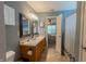 Bathroom with double vanity, shower, and view into the bedroom at 939 Arabian Way, Bargersville, IN 46106