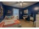 Charming bedroom with blue accent wall, stylish decor, and cozy furnishings, creating a relaxing retreat at 939 Arabian Way, Bargersville, IN 46106