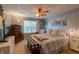 Cozy bedroom with a ceiling fan, large window, and soft decor at 939 Arabian Way, Bargersville, IN 46106