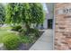 Charming home entrance with a brick facade, landscaped garden, and seating area at 939 Arabian Way, Bargersville, IN 46106